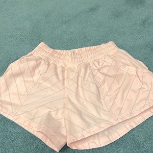 Light pink with gray stripe.  Shorts without defects.
